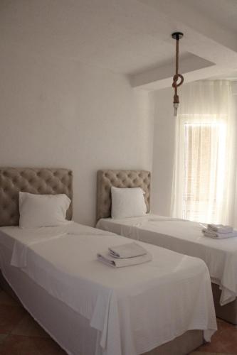 Katil atau katil-katil dalam bilik di Egnatia En Suites