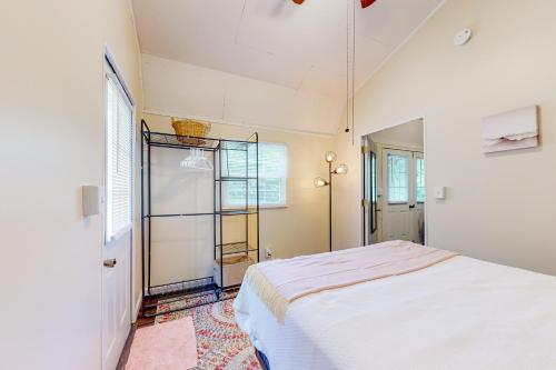 a bedroom with a bed and a ladder in it at Addies Nest in Sevierville