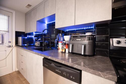 a kitchen with a sink and a dishwasher in it at Condo in St-Roch Downtown Quebec City in Quebec City