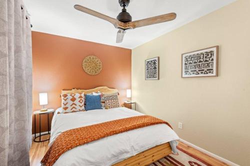 a bedroom with a bed with a ceiling fan at The Hummingbird House, Sauna & Mountain Views! in Phoenix