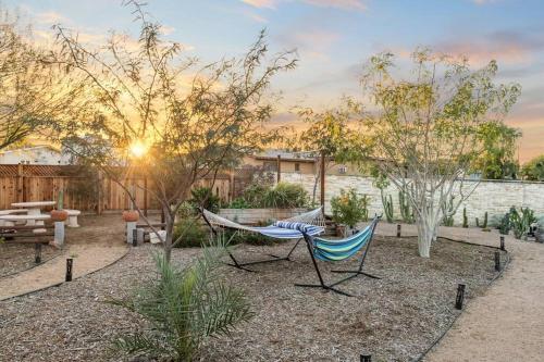 a hammock in the middle of a garden at The Hummingbird House, Sauna & Mountain Views! in Phoenix