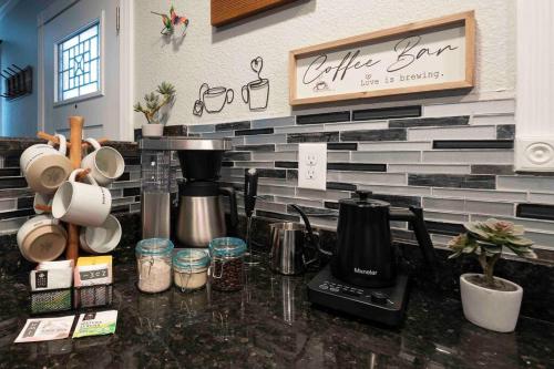 a kitchen with a counter with a coffee maker on it at The Hummingbird House, Sauna & Mountain Views! in Phoenix