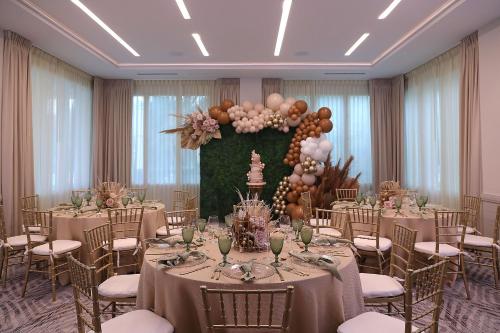a banquet hall with tables and chairs and balloons at InterContinental At Doral Miami by IHG in Miami