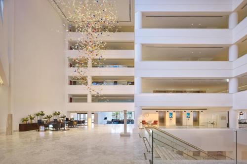 a view of the lobby of a building with a chandelier at Parklane, a Luxury Collection Resort & Spa, Limassol in Limassol