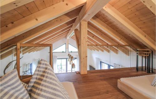 a large room with wooden ceilings and wooden beams at Schoorenmoos Lodge in Dietmannsried