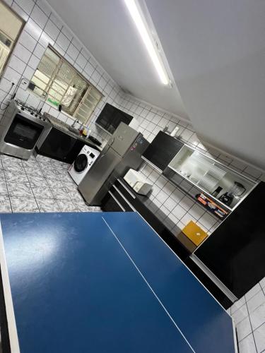 an overhead view of a kitchen with a blue floor at Hotel Congonhas 1 in Sao Paulo