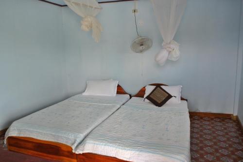 Postelja oz. postelje v sobi nastanitve Tavendang Guesthouse