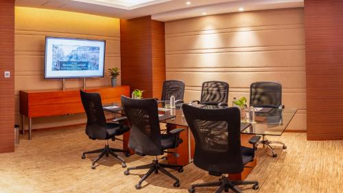 a conference room with a table and chairs at Hyatt Pune in Pune