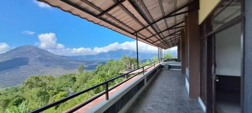 a balcony with a view of a mountain at The Kayuan in Kintamani