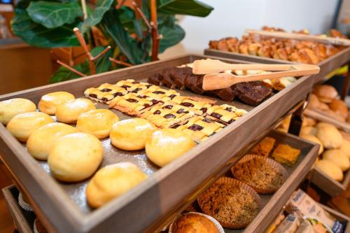 a display of different types of donuts and other pastries at Hotel Flaminia in Sirmione