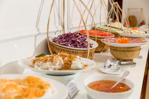 a group of bowls of food on a table at Prime New Hotel in Nha Trang