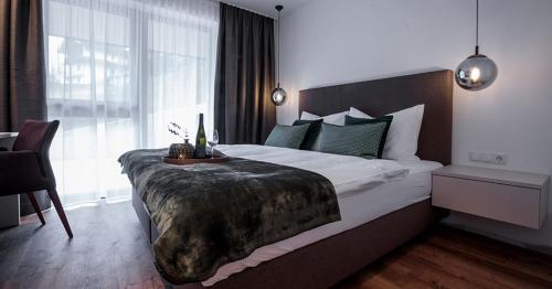A bed or beds in a room at Wein Neururer