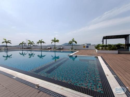 a swimming pool on the roof of a building at JOVIAL Modern Cozy Homestay `Meritus Perai in Perai