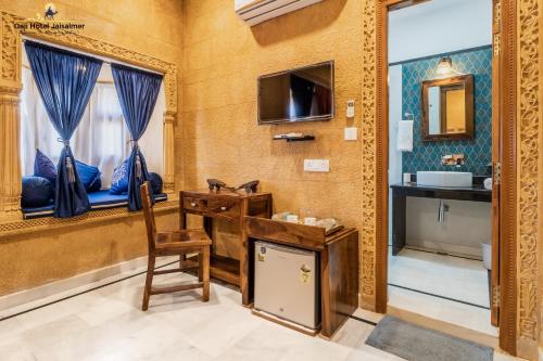a bathroom with a sink and a mirror at Gaji Hotel Jaisalmer in Jaisalmer