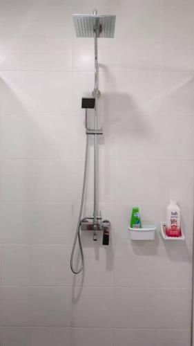 a white bathroom with a shower in the wall at Cozyhome Encorp Strand Alpha IVF 4px in Petaling Jaya