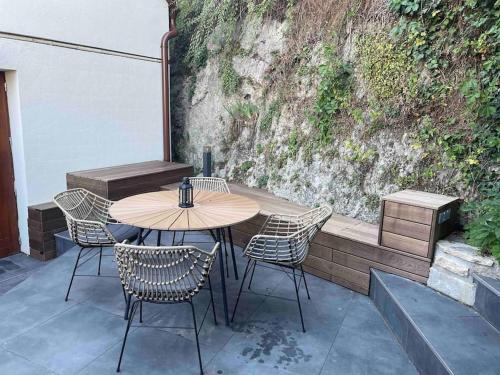 a table and chairs sitting on a patio at Morris Vacka in Veszprém