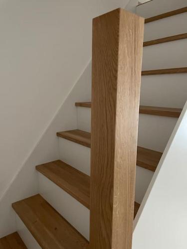 a staircase with wooden steps in a house at Morris Vacka in Veszprém