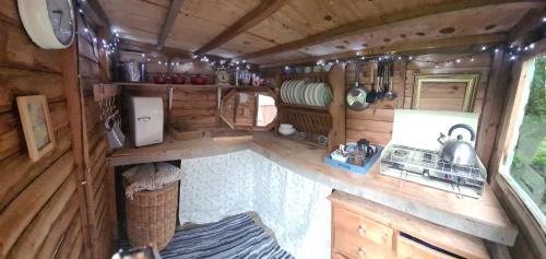 an interior view of a kitchen in a rv at The Potting Shed in Manuden