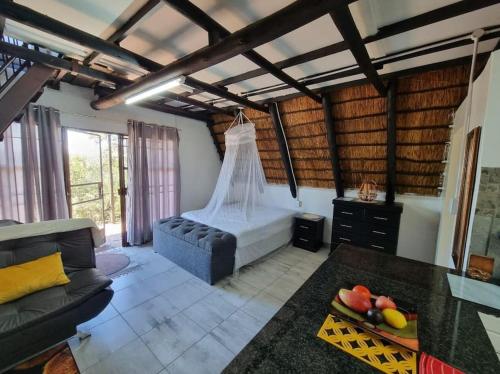 Posezení v ubytování Bietjie Bos Chalet