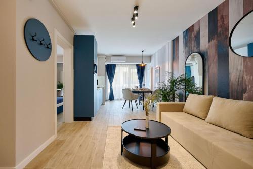 a living room with a couch and a table at VDR Holiday Apartment 139 in Infinity Beach Resort - parking in Mamaia