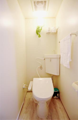 Um banheiro em HOTEL AARON通天西