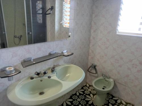 a bathroom with a sink and a toilet at El Raco, C-9-17 in Cullera