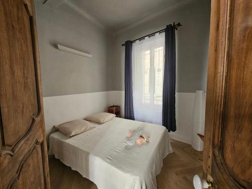a child laying on a bed in a bedroom at Blue Note Home, Cosy, Port Vieux in La Ciotat