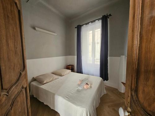 a child laying on a bed in a bedroom at Blue Note Home, Port Vieux, Parking, Crew, Couple in La Ciotat