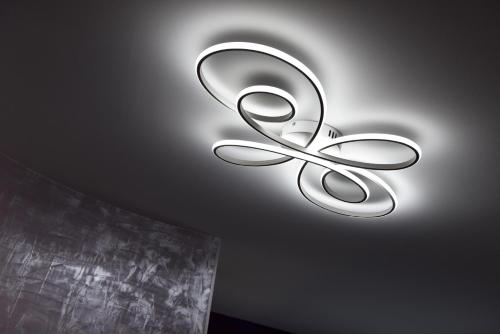 a ceiling light with a pair of scissors on it at domaine d' Arcalis in Archiac