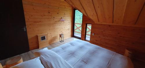 an overhead view of a bedroom in a log cabin at Котедж Гук in Rakhiv