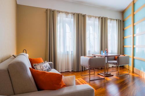 a living room with a couch and a table at Hotel Compostela in Santiago de Compostela
