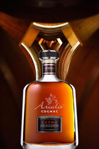 a bottle of nigella cognac sitting on a table at domaine d' Arcalis in Archiac