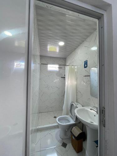 a bathroom with a toilet and a sink at TAMAZI in Kobuleti