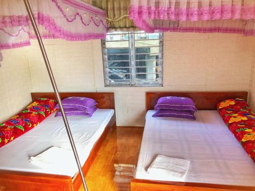 Postel nebo postele na pokoji v ubytování Thanh Xuan Homestay and Bungalow