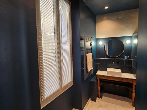 a bathroom with a sink and a mirror at Blue Note Home, Cosy, Port Vieux in La Ciotat