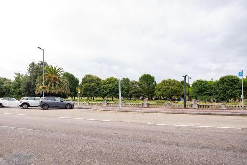 a row of cars parked on the side of a road at Solent Court in Portsmouth