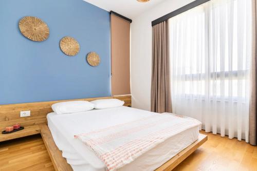 A bed or beds in a room at Urloft Çeşmealtı