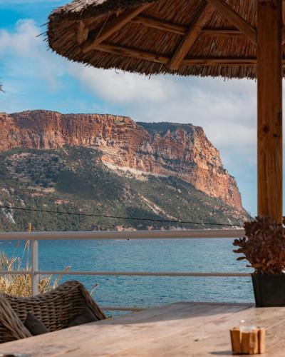 a view of the ocean and a mountain at Hotel de La Plage - Mahogany in Cassis