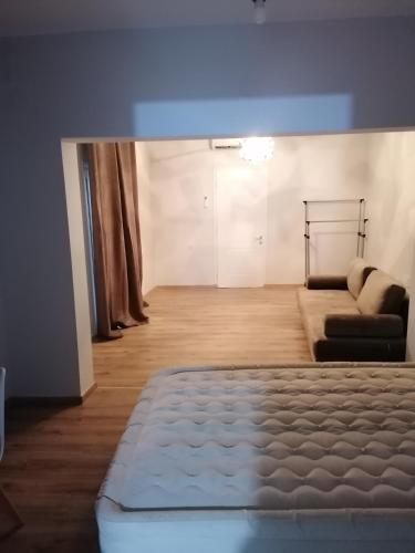 Una cama o camas en una habitación de Διαμέρισμα Ολόκληρου ορόφου Queen Luxury