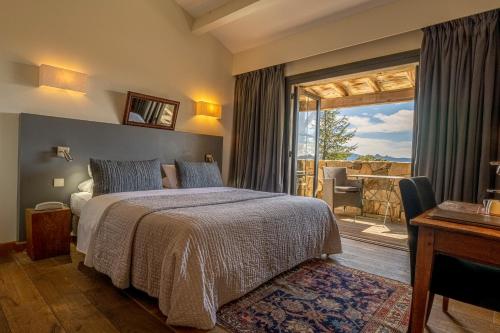 a bedroom with a bed and a window with a patio at Auberge A Pignata in Levie