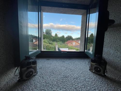 a room with a large window and two speakers at Casa de Costoia in Santiago de Compostela