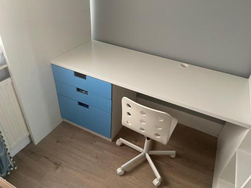 an office desk with a white counter and a chair at Walpole House 2 in London