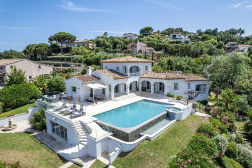 an aerial view of a house with a swimming pool at Les Agathea in Saint-Tropez