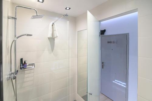 a shower with a glass door in a bathroom at 25 Dikaiosinis Ave. in Heraklio Town