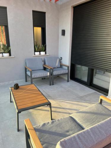 a living room with couches and a table at Grand Kourouta in Kourouta