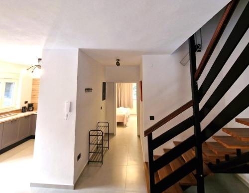 a staircase leading to the kitchen and living room of a house at Villa Brajkovic in Rovinj