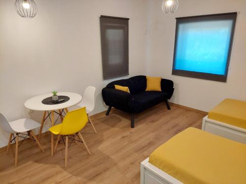 a living room with a couch and a table at Šimun&Jakov in Drinovci