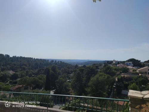 a view of the valley from the top of a hill at La suite Miroir, Love Room in Bouc-Bel-Air