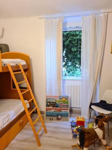 a bedroom with a bunk bed and a window at i gabbiani in Chiavari