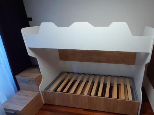 a white box sitting on the floor next to some stairs at Appartamento a Dimaro in Val di Sole in Monclassico